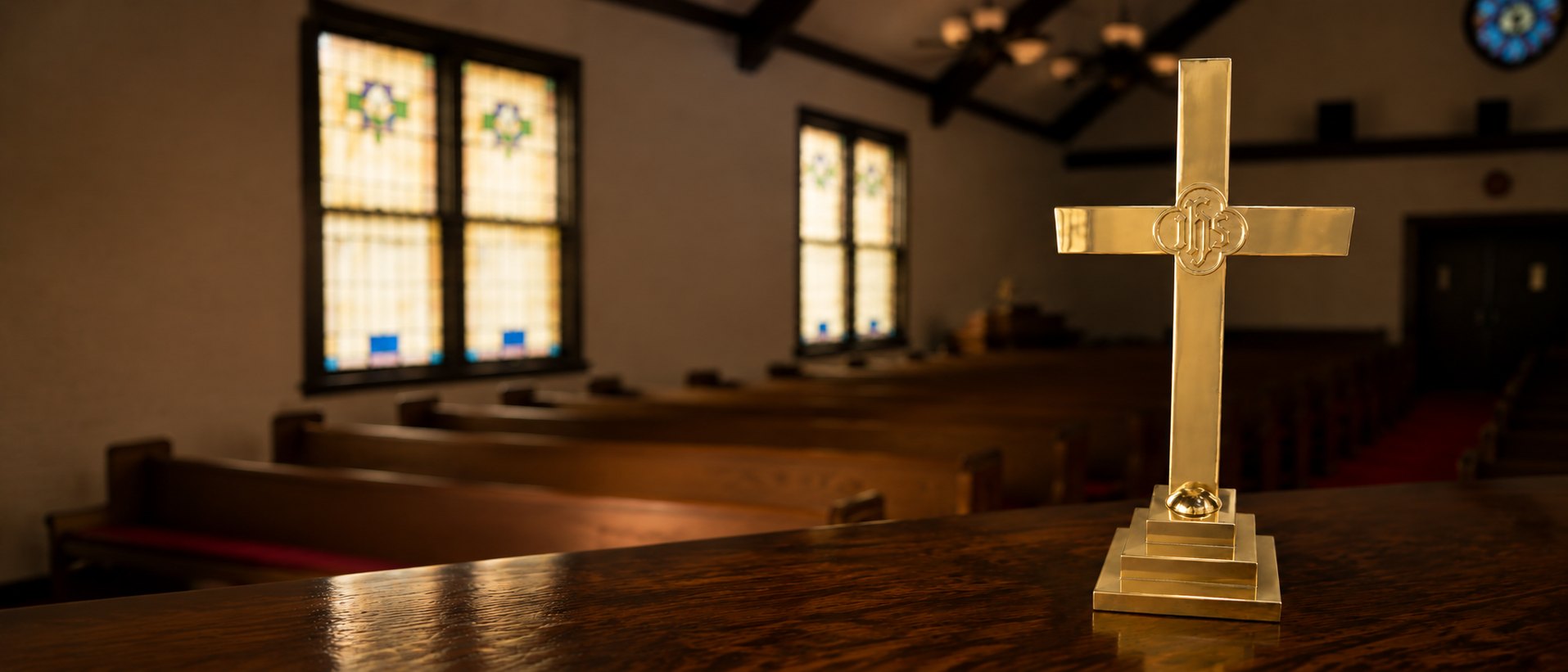 A gold cross in the sanctuary at First Christian Church of Chandler