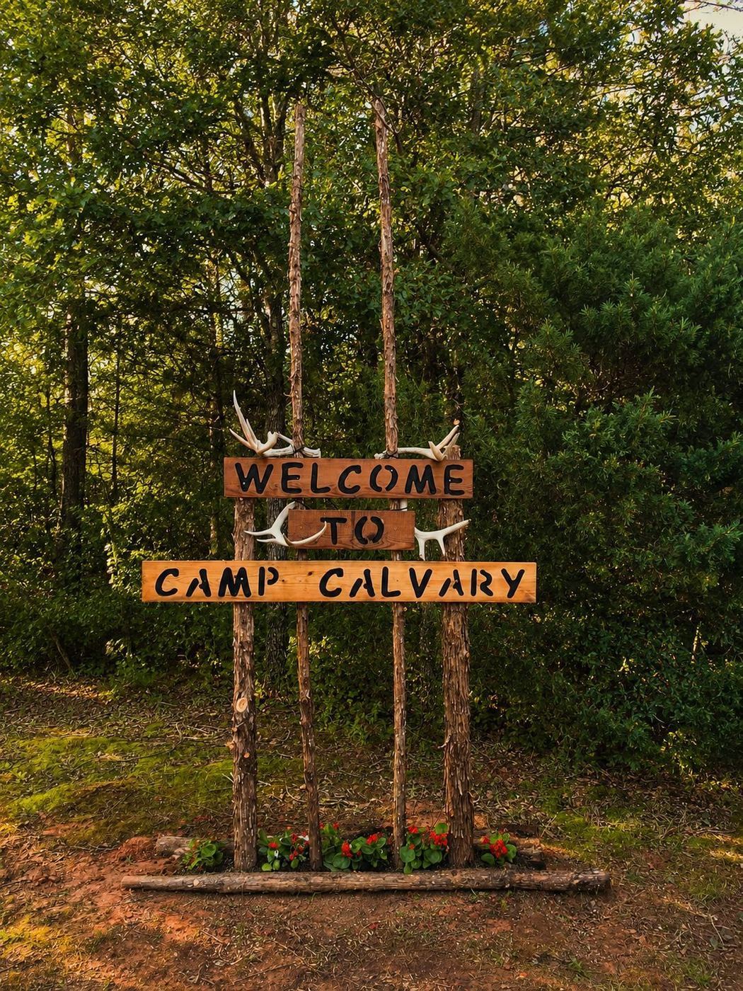 Rustic welcome sign at Camp Calvary