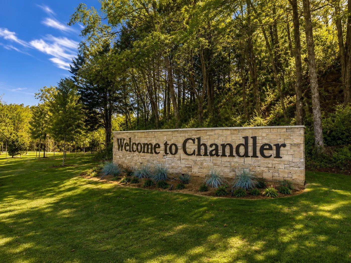 Welcome to Chandler stone sign surrounded by trees and green space