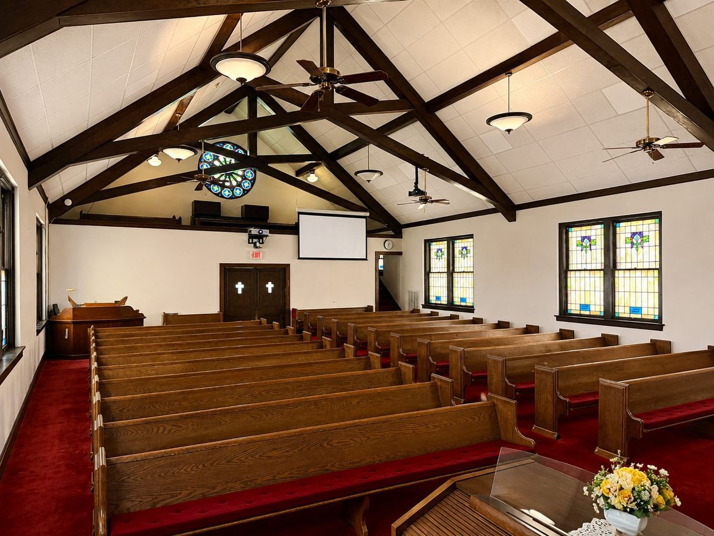 FCC sanctuary pews beneath the rose window